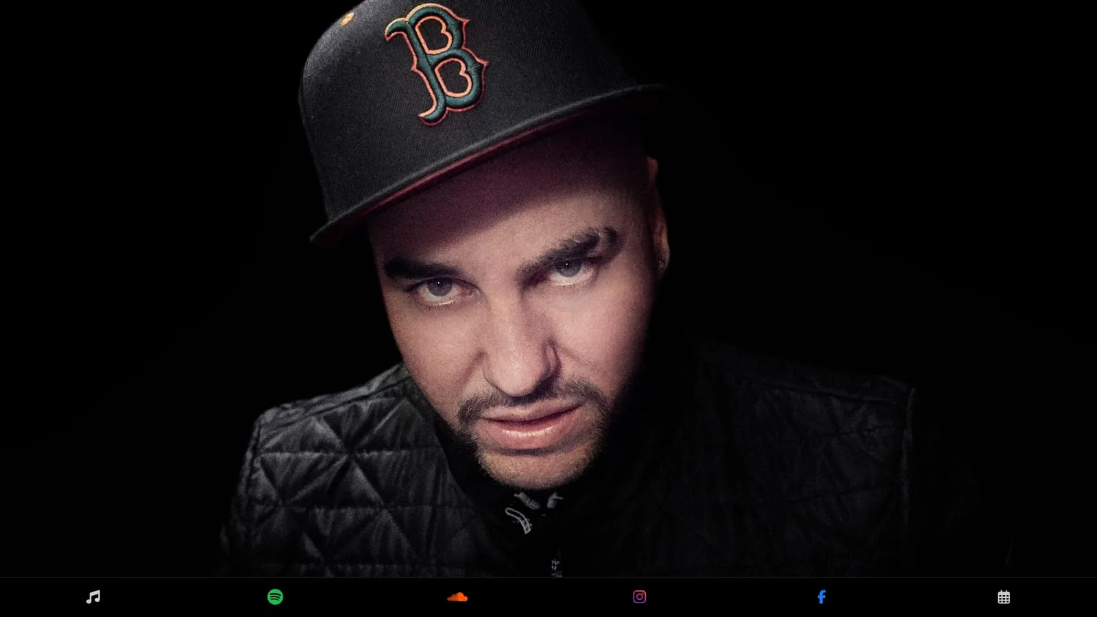 MDOT.world portrait splash page with bottom music and social dock on black